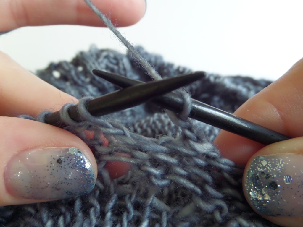 One chain stitch after the stitch on the right needle.